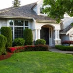 Beautiful home exterior during late spring season with clean landscape